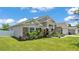 Lovely single-story home featuring manicured landscaping, stone accents, and a well-maintained lawn at 1028 15Th Ne St, Winter Haven, FL 33881