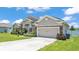 Charming single-Gathering home with a two-car garage, stone accents, and a well-manicured lawn at 1028 15Th Ne St, Winter Haven, FL 33881