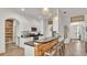 Modern kitchen with stainless steel appliances, wood countertops, and breakfast bar seating at 1028 15Th Ne St, Winter Haven, FL 33881