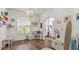 Bright playroom with wood-look flooring and natural light beaming through the large window at 1028 15Th Ne St, Winter Haven, FL 33881