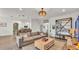 Spacious living room showcasing a comfortable sectional sofa and an open floor plan at 1028 15Th Ne St, Winter Haven, FL 33881
