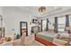 Bright and spacious main bedroom with a view, ample natural light, and comfortable furnishings at 1028 15Th Ne St, Winter Haven, FL 33881