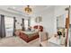 Cozy main bedroom with natural light, tray ceiling, and a comfortable layout at 1028 15Th Ne St, Winter Haven, FL 33881