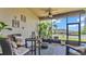 Inviting screened patio with comfortable seating, brick flooring, and a view of the backyard at 1028 15Th Ne St, Winter Haven, FL 33881