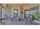 Covered patio with brick flooring, bench seating, string lights, and view of the landscape at 1028 15Th Ne St, Winter Haven, FL 33881
