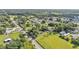 High aerial view of a neighborhood with the road, homes, and green spaces all showing at 1050 Reynolds Rd, Lakeland, FL 33801