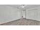 Spacious bedroom with ceiling fan, wood-look floors and a closet with bi-fold doors at 1050 Reynolds Rd, Lakeland, FL 33801