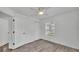 Spacious bedroom with ceiling fan, wood-look floors, a window and closet with bi-fold doors at 1050 Reynolds Rd, Lakeland, FL 33801