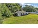 Charming single-story home with a well-maintained yard and mature trees providing ample shade at 1050 Reynolds Rd, Lakeland, FL 33801