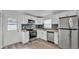 Updated kitchen featuring modern appliances, sleek cabinetry, and stylish backsplash at 1050 Reynolds Rd, Lakeland, FL 33801
