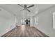 Modern living room with sleek flooring and an open concept design, flowing into the kitchen at 1050 Reynolds Rd, Lakeland, FL 33801
