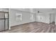 Spacious living area with ample natural light, showcasing the updated flooring and modern fixtures at 1050 Reynolds Rd, Lakeland, FL 33801