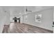 Inviting living room with stylish flooring and a view into the updated kitchen area at 1050 Reynolds Rd, Lakeland, FL 33801