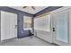 Cozy, enclosed porch featuring a chair and two entryways for easy access at 1050 Reynolds Rd, Lakeland, FL 33801