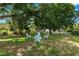 A spacious backyard featuring an inviting fire pit area, perfect for cozy outdoor gatherings at 114 Ed Padgett Rd, Lakeland, FL 33809