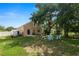A spacious backyard with a fire pit area offers relaxation and outdoor gatherings at 114 Ed Padgett Rd, Lakeland, FL 33809