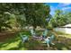 A spacious backyard featuring an inviting fire pit area, perfect for cozy outdoor gatherings at 114 Ed Padgett Rd, Lakeland, FL 33809