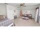 bedroom with a twin bed, sofa, and creative neon art decor at 114 Ed Padgett Rd, Lakeland, FL 33809