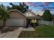 Charming single-Gathering home with a well-manicured lawn, white picket fence and attached two car garage at 114 Ed Padgett Rd, Lakeland, FL 33809