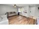 Bright living room with hardwood floors, comfortable seating, and ample natural light at 114 Ed Padgett Rd, Lakeland, FL 33809