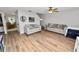 Bright living room with hardwood floors, comfortable seating, and ample natural light at 114 Ed Padgett Rd, Lakeland, FL 33809