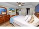 The primary bedroom boasts hard wood floors and a mounted television at 114 Ed Padgett Rd, Lakeland, FL 33809