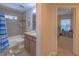 Bathroom with shower-tub combo and a sink with dark wooden cabinets and a granite countertop at 13 Count Fleet Dr, Ocala, FL 34482