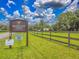 Meadow Wood Farms signage showcases the entrance to a deed-restricted community with a speed limit of 30 MPH at 13 Count Fleet Dr, Ocala, FL 34482