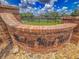 Meadow Wood Farms entrance features brick sign with metal lettering, a lush lawn, and a black fence at 13 Count Fleet Dr, Ocala, FL 34482