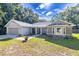 Charming single-story home with stone accents, attached garage, and well-maintained front yard at 13 Count Fleet Dr, Ocala, FL 34482
