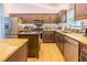 Well-equipped kitchen featuring stainless steel appliances, an island, and granite countertops at 13 Count Fleet Dr, Ocala, FL 34482