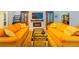 Bright living room with decorative fireplace, large TV, and comfortable seating arrangement on a colorful rug at 13 Count Fleet Dr, Ocala, FL 34482