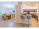 View of dining area, breakfast bar, and kitchen with stainless steel appliances and granite countertops at 13 Count Fleet Dr, Ocala, FL 34482