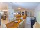 Open-concept living space with dining area, living room, and kitchen, perfect for entertaining at 13 Count Fleet Dr, Ocala, FL 34482