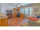 Home office with hardwood floors, built-in shelves, desk, and a bright bay window at 13 Count Fleet Dr, Ocala, FL 34482