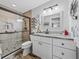 Modern bathroom featuring glass shower, tile floors, and stylish vanity at 1308 Timberidge N Loop, Lakeland, FL 33809