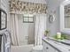 Bright bathroom with tub, tile surround, and classic vanity at 1308 Timberidge N Loop, Lakeland, FL 33809