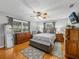 Comfortable bedroom with natural light, hardwood floors, and stylish decor at 1308 Timberidge N Loop, Lakeland, FL 33809