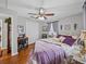 This bedroom features hardwood floors, ceiling fan, and a closet at 1308 Timberidge N Loop, Lakeland, FL 33809