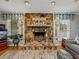 Detailed shot of a stone fireplace and hardwood flooring at 1308 Timberidge N Loop, Lakeland, FL 33809