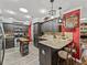 Inviting kitchen featuring dark cabinets, granite countertops, and stainless steel appliances at 1308 Timberidge N Loop, Lakeland, FL 33809