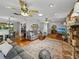 Open-concept living room with hardwood floors and a stone fireplace at 1308 Timberidge N Loop, Lakeland, FL 33809