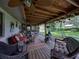 Covered patio with seating and outdoor decor offers a relaxing outdoor space at 1308 Timberidge N Loop, Lakeland, FL 33809
