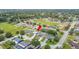 Bright aerial view of a charming neighborhood with mature trees and well-maintained homes at 1420 Meadows Pond Dr, Bartow, FL 33830