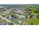 Aerial view of residential neighborhood showcasing well-maintained lawns and landscaping at 1420 Meadows Pond Dr, Bartow, FL 33830