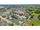 Aerial view of home in residential neighborhood, showcasing well-maintained yards and landscaping at 1420 Meadows Pond Dr, Bartow, FL 33830