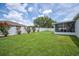 The home boasts a beautiful backyard, complete with white fence and covered lanai at 1420 Meadows Pond Dr, Bartow, FL 33830