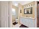 Bathroom with white cabinets, a granite vanity, and a tiled shower with a glass door at 1420 Meadows Pond Dr, Bartow, FL 33830