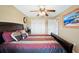 Bedroom featuring a comfortable bed, neutral walls, and closet space with natural light at 1420 Meadows Pond Dr, Bartow, FL 33830