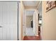 Hallway with hardwood floors leading to bedroom and other rooms in the house at 1420 Meadows Pond Dr, Bartow, FL 33830